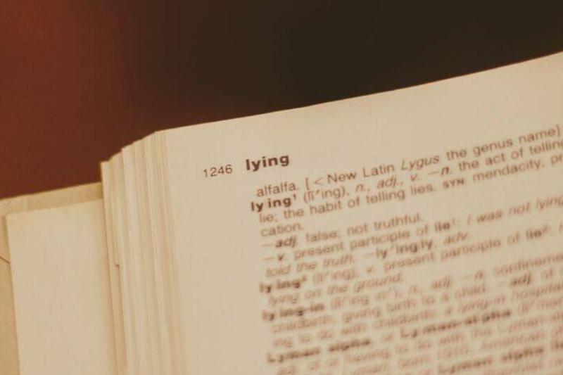 A dictionary page with the word 'lying' at the top.