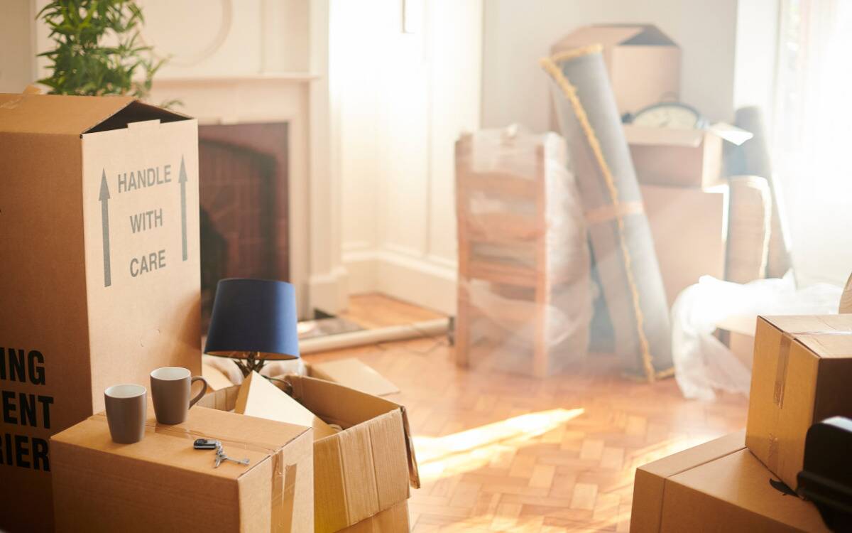 A home filled with moving boxes and other objects.
