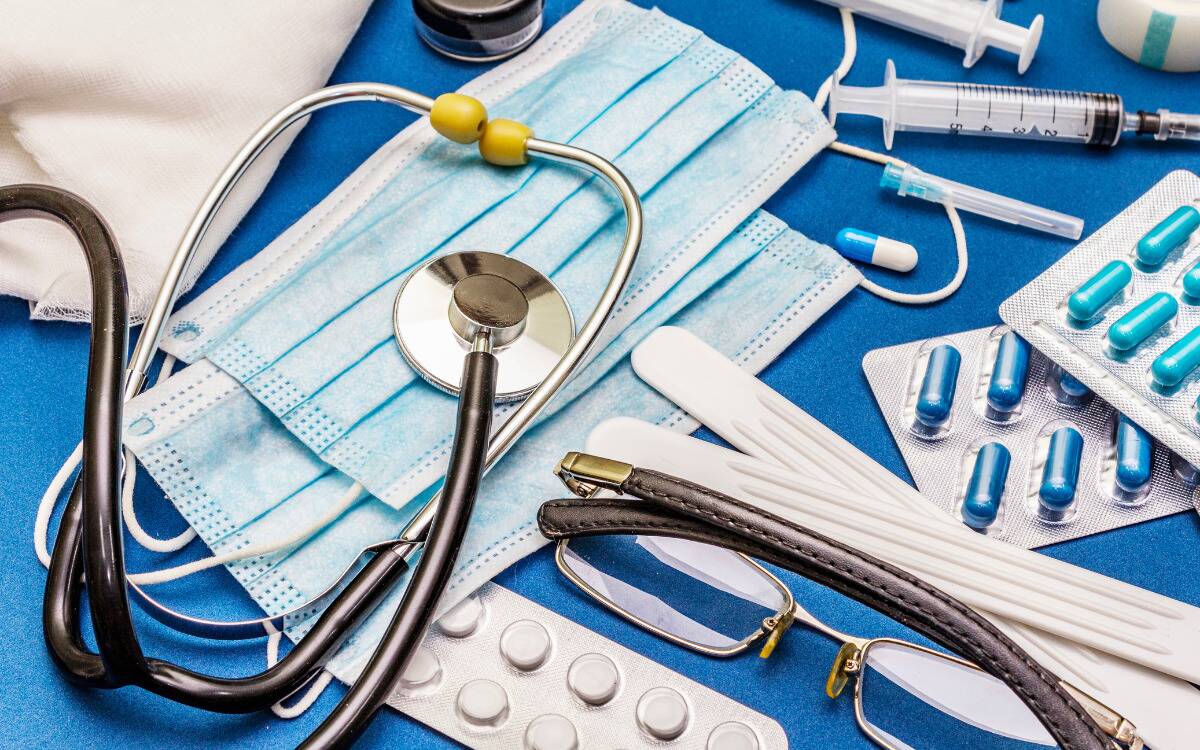 A table covered in medical and doctor supplies.