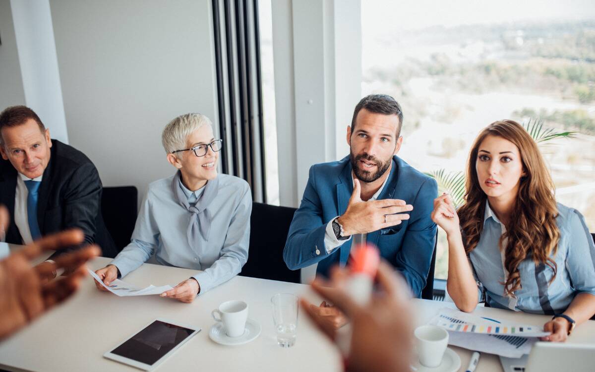 A group of employees in a work meeting.