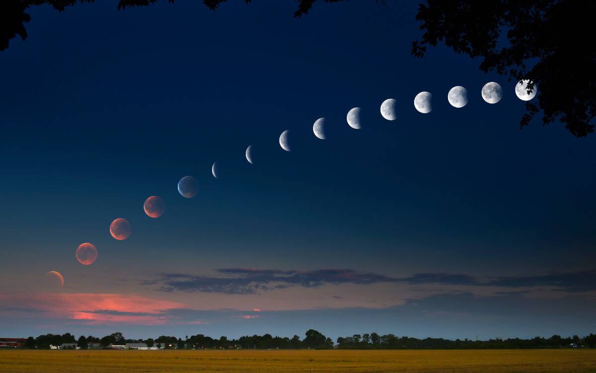 Each of the moon phases stretched out over a single image of the sky.