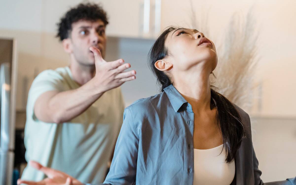 A couple arguing, the man gesturing angrily while the woman looks exasperated.