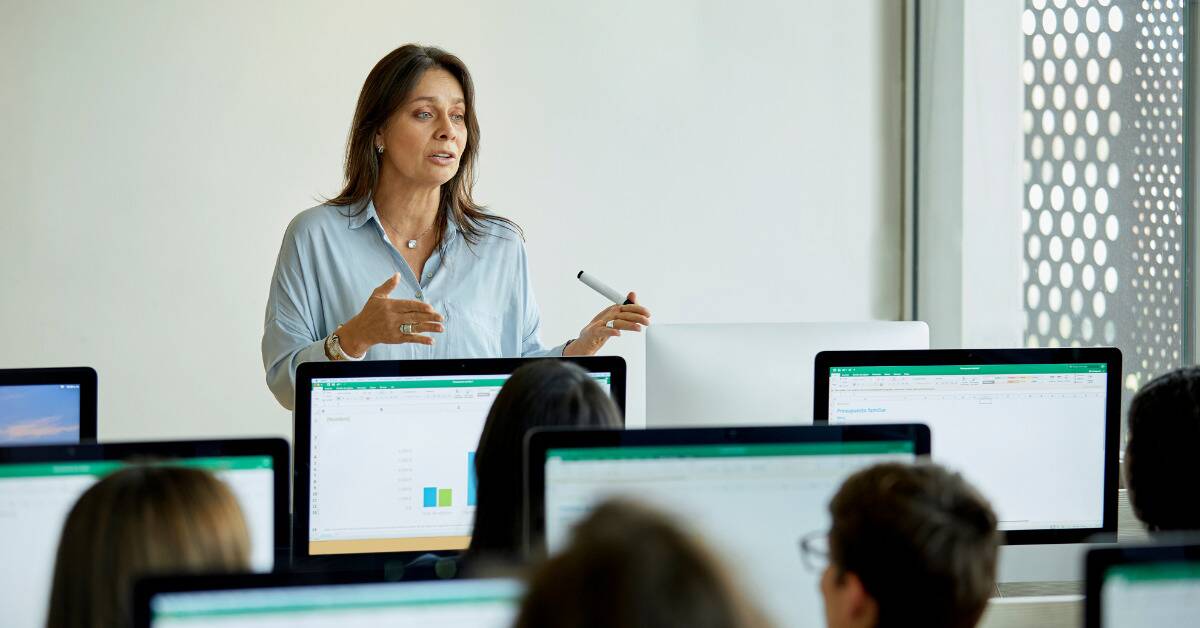 A woman leading a classroom.