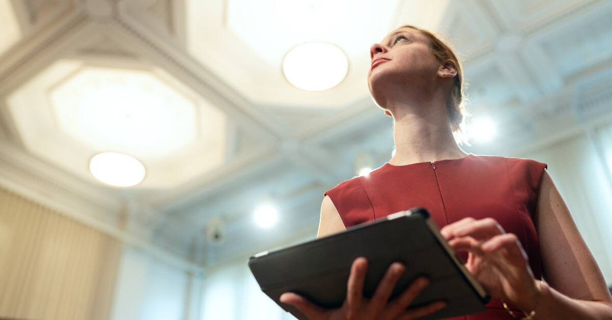 A low angle shot of a powerful woman looking foward.