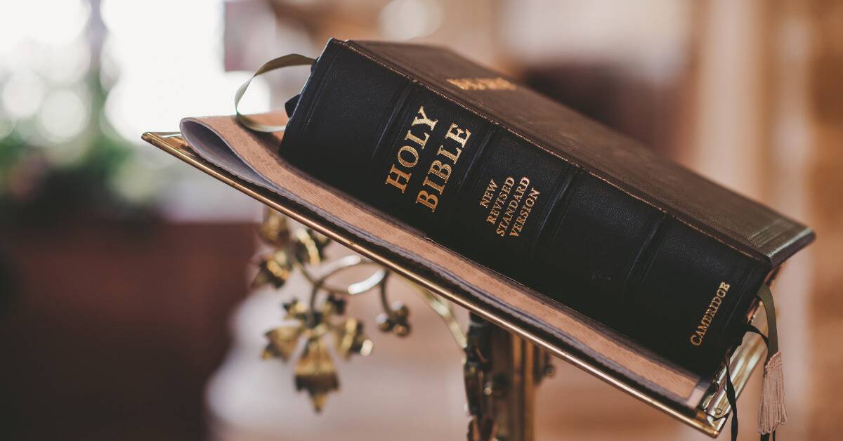 The Bible sitting closed on a pedestal.