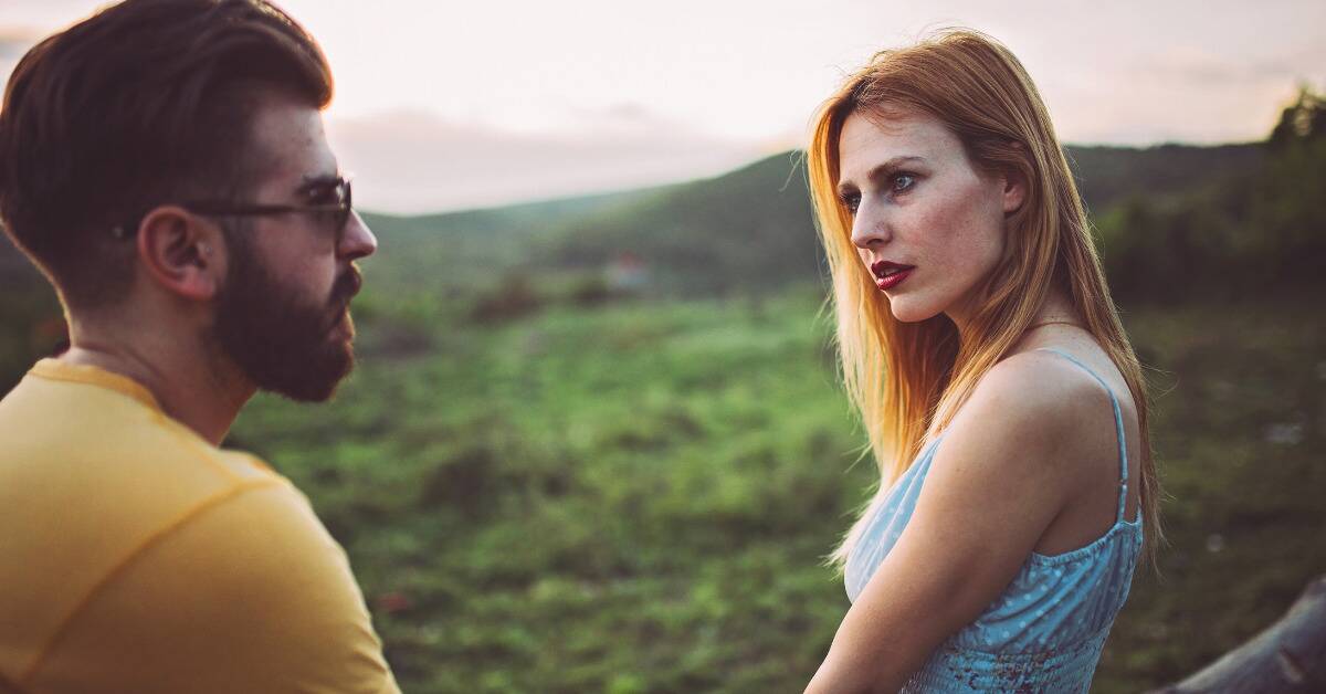 A woman looking over at her boyfriend with an offended look.