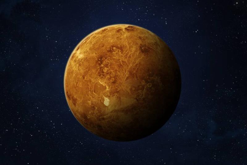 A render of Venus against a blue-toned starry sky.