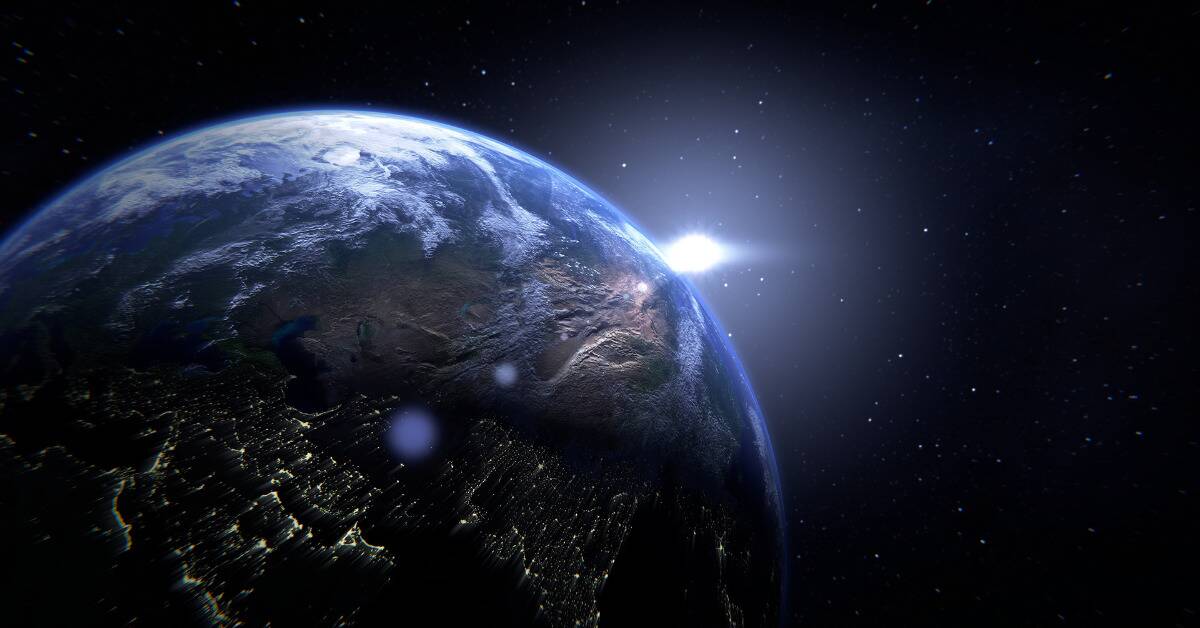 A render of Earth with a bright white light cresting over the horizon.