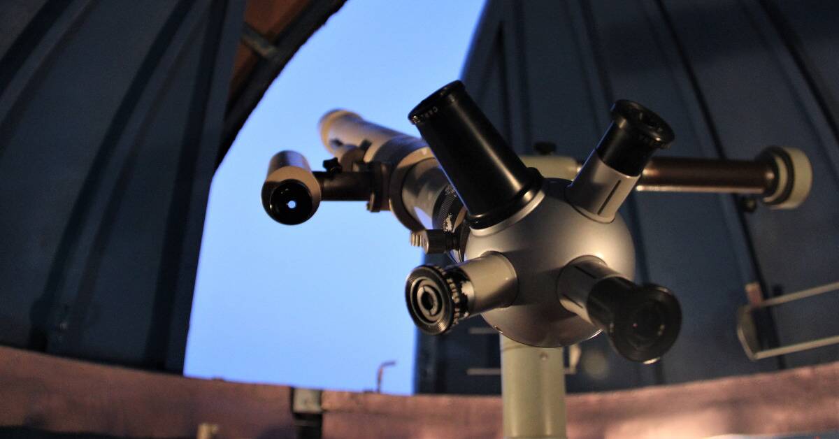 A large, professional telescope pointed out