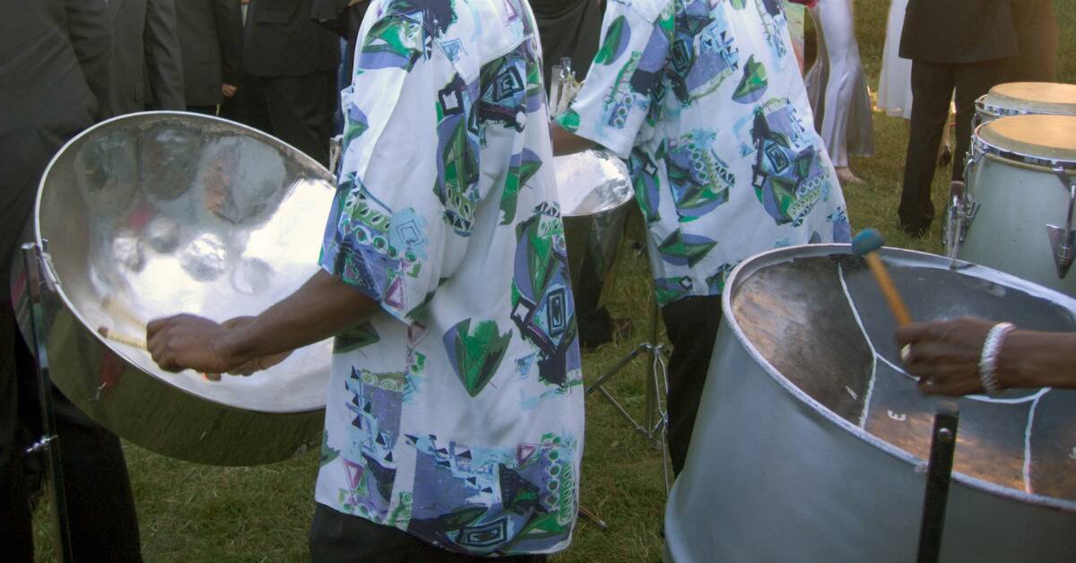 Some steel drum players in bright patterned shirts.