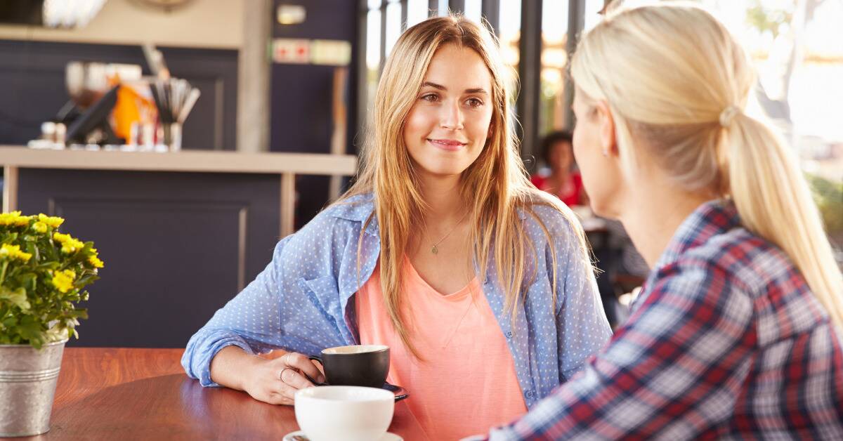 Two friends chatting over coffee.