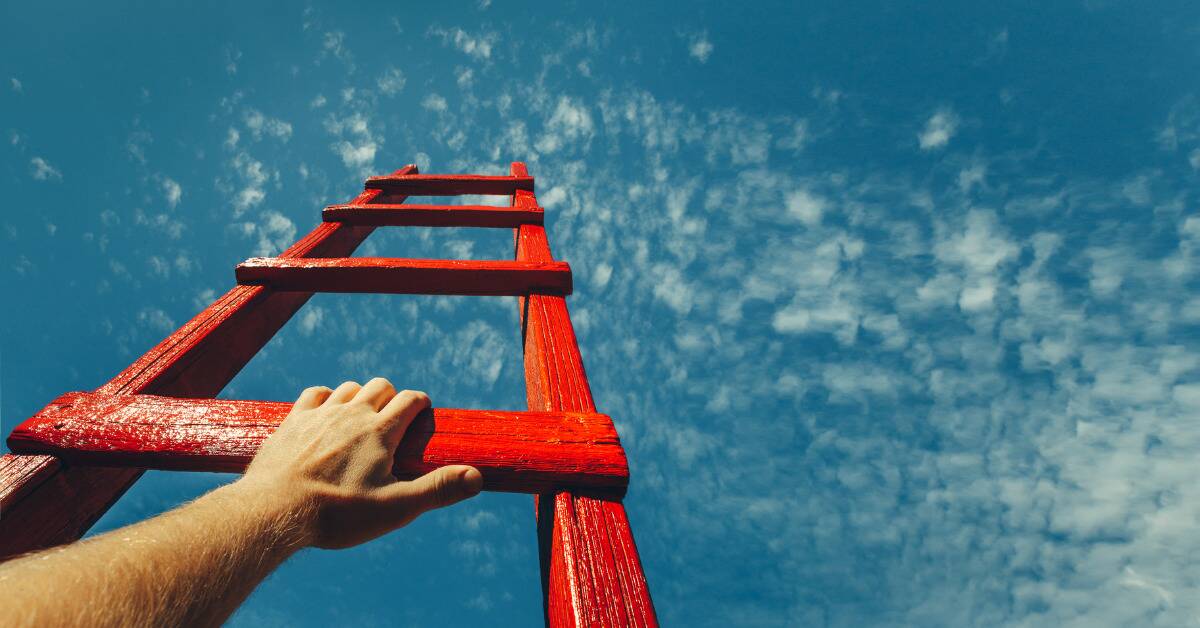 A red ladder reaching up to the sky, a hand grabbing its bottom-most visible rung.