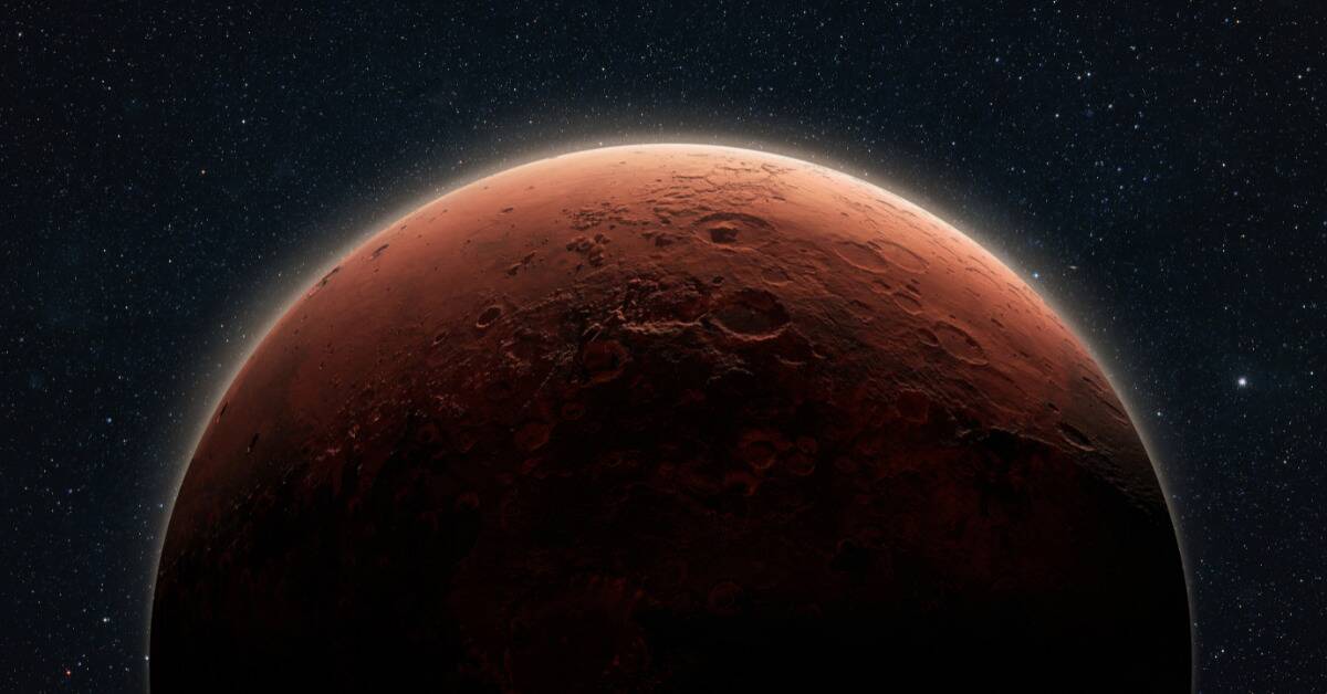 A close render of a heavily shadowed Mars in space.