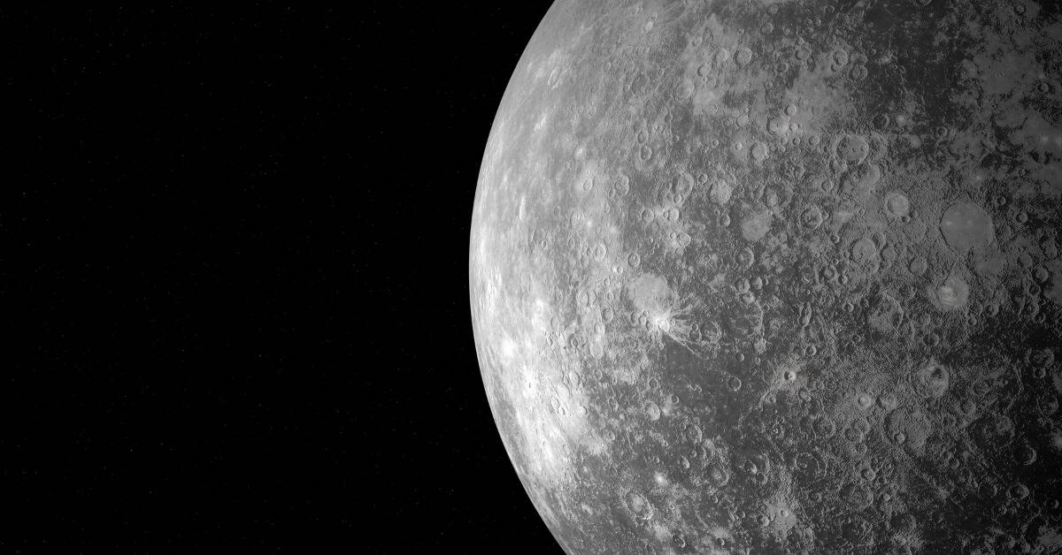 A close shot of Mercury in space, all its craters visible.