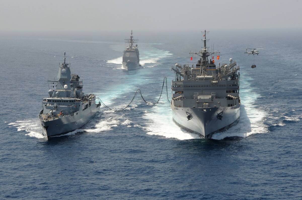 Guided-missile cruiser USS Hue City (CG 66), the German navy frigate FGS  Hamburd (F220), the aircraft carrier USS Dwight D. Eisenhower (CVN 69),
 and the Military Sealift Command fast combat support ship USNS Bridge 
(T-AOE 10) during a replenishment-at-sea, Arabian Sea, 2013.