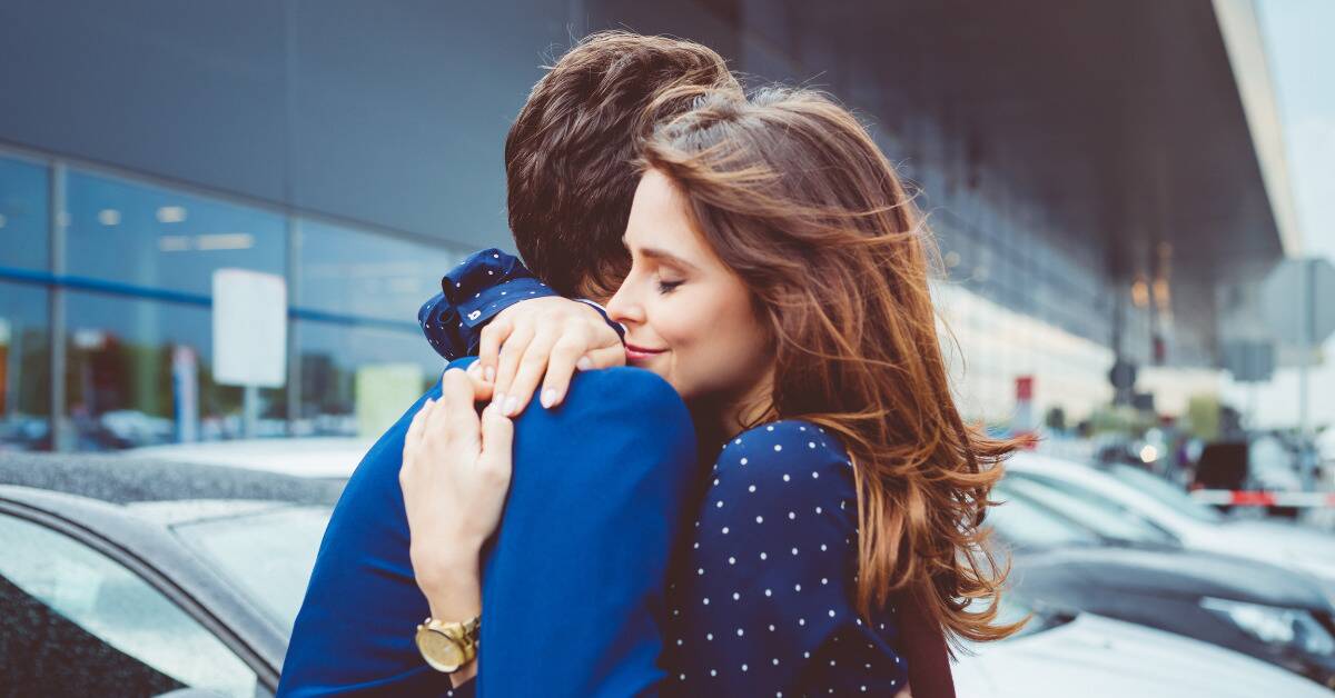 Two people in a close embrace.