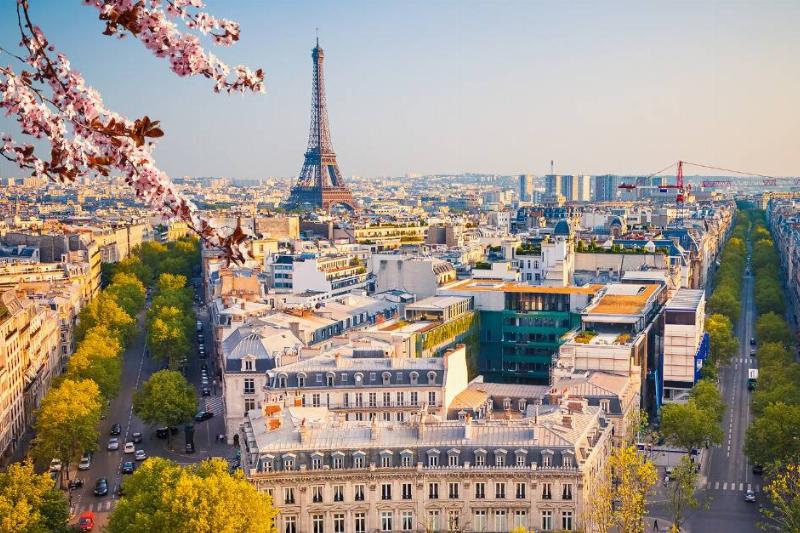 A wide shot of Paris, France, the Eiffel Tower clearly visible.