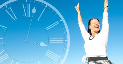 A woman standing outside, arms thrown up in victory. Next to her is a large, semi-transparent clock graphic with roman numerals.