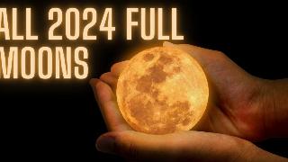 A pair of hands cupping a small, glowing moon. 