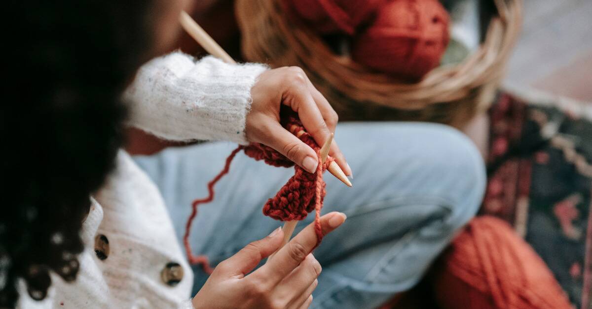 A woman starting a knitting project.