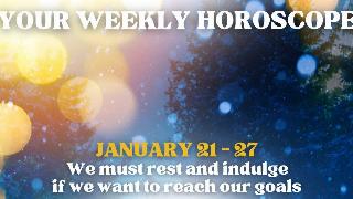 A shimmery photo of some trees in the snow with large yellow light spots with text on top that reads, 