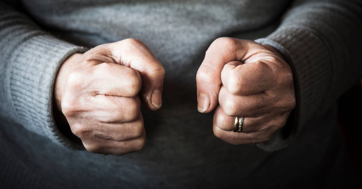 A close shot of two clenched fists.