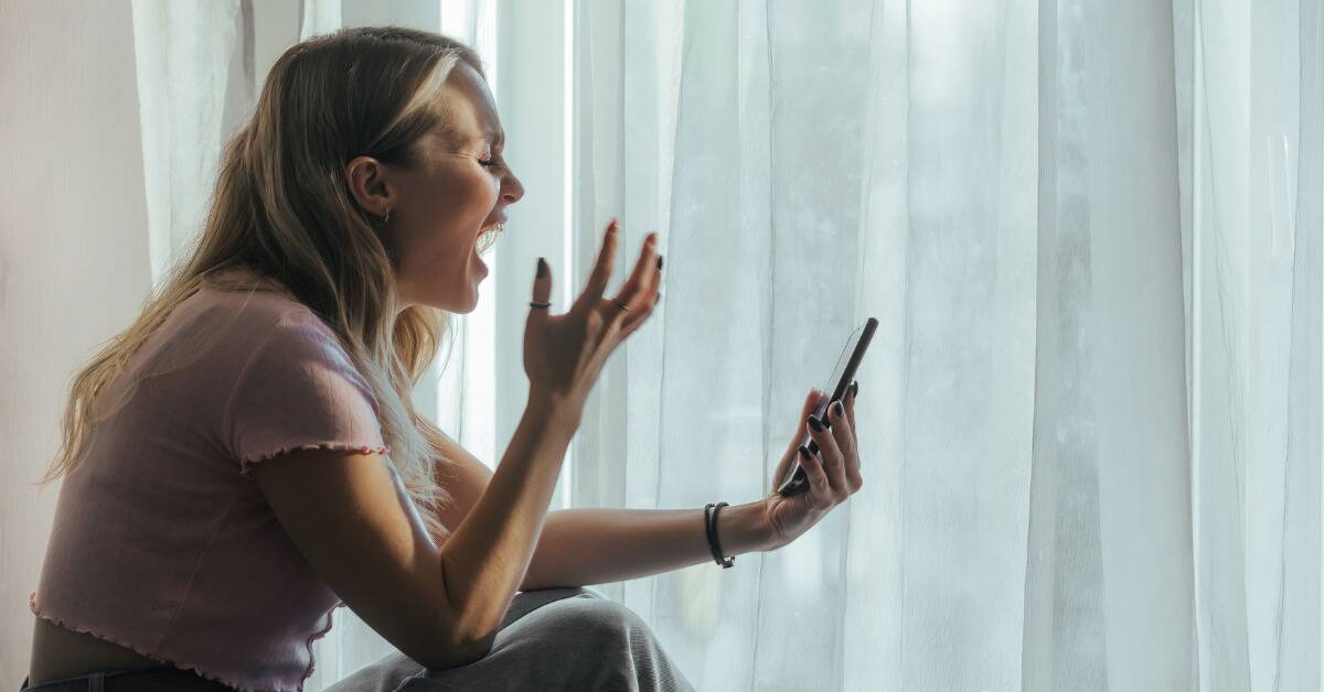A woman shouting at her phone.