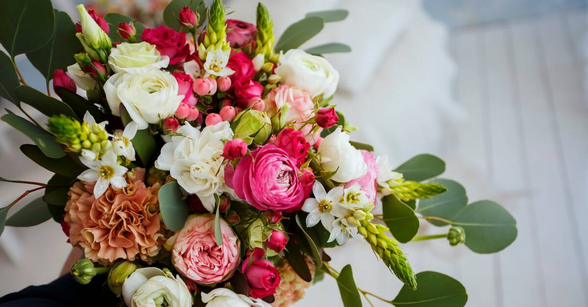 An intricate bouquet of pink and white flowers.