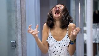 A woman yelling in frustration.