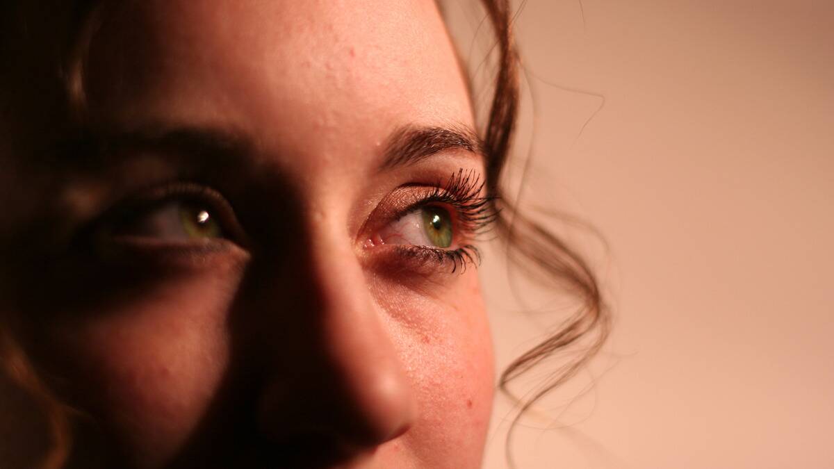 A close shot of a woman's eye as she looks off to the side.