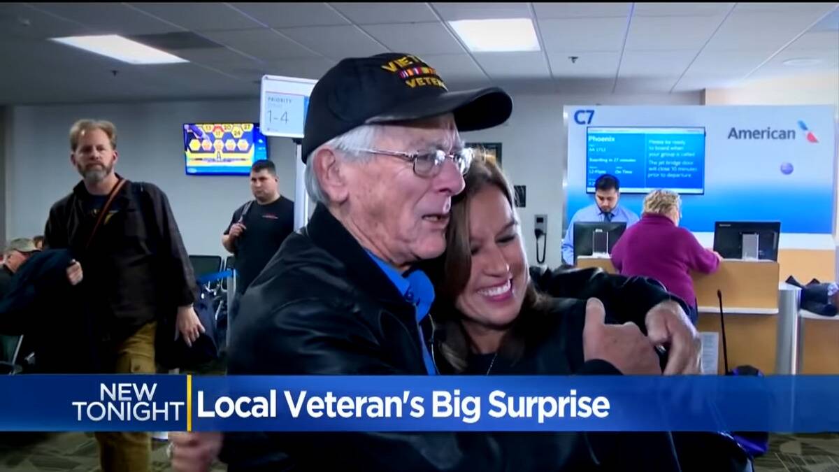 Barnes and Robles meeting at the airport, Barns giving Robles a side hug.