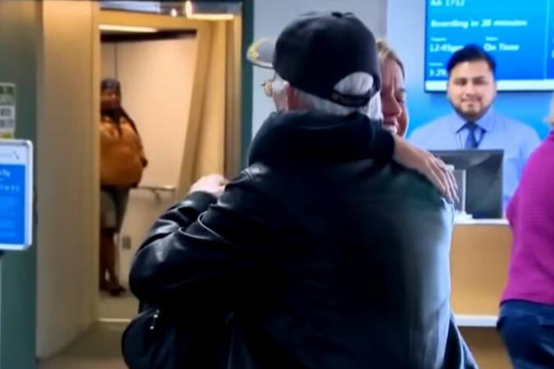 Barnes and Robles meeting at the airport, sharing their first hug.