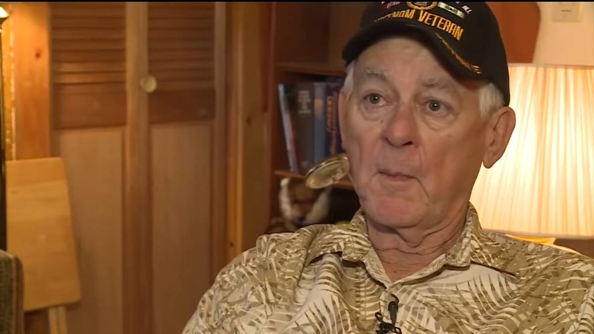 Barnes sitting at home in his Vietnam Veteran cap.