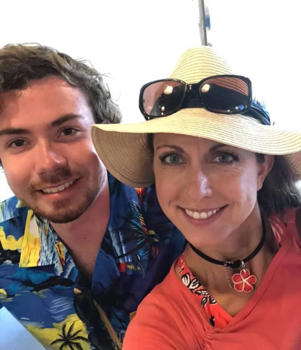 Mary Ann taking a selfie with her son, Tyler, both in summertime clothes.