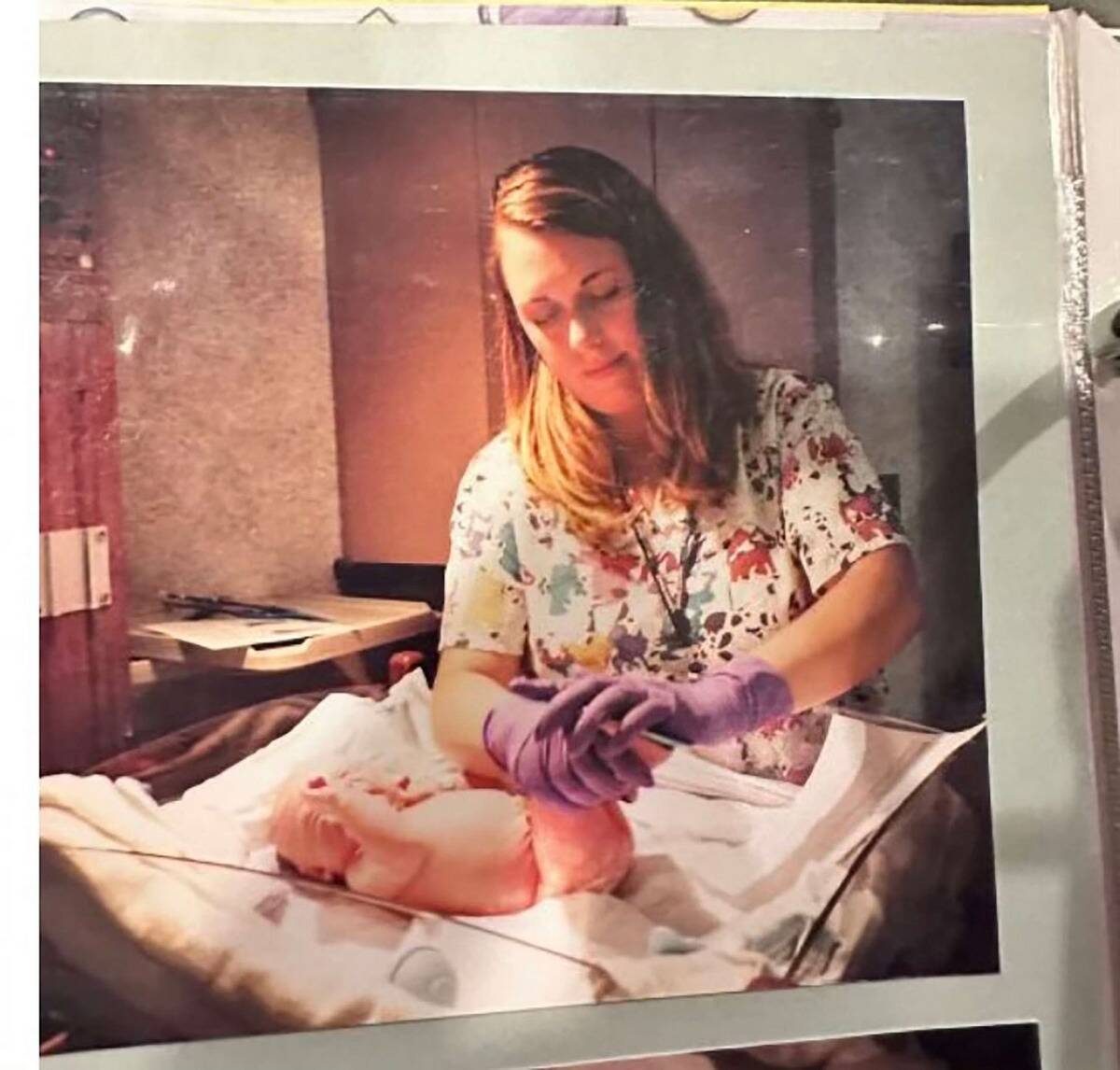Kelsey's baby photo from the day of her birth, Mary Ann tending to her.