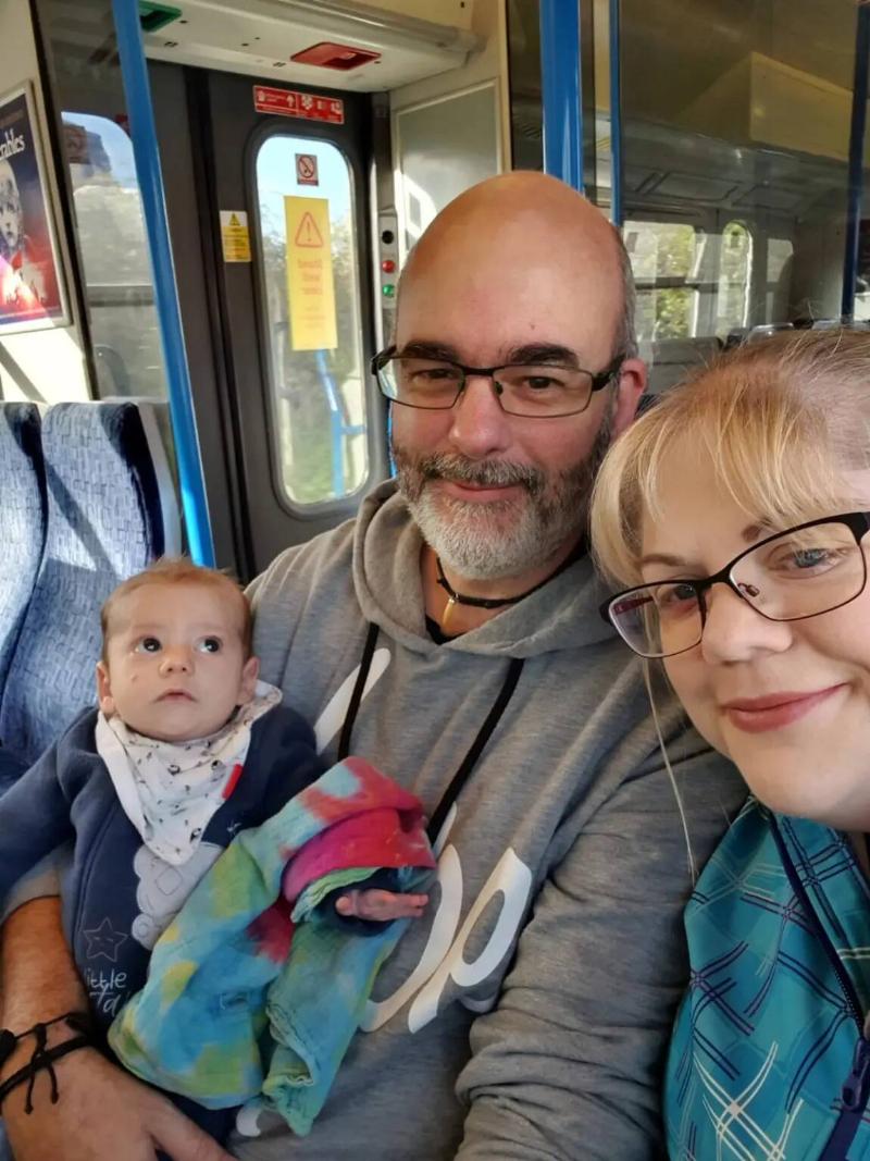 Thomas with his parents while they ride the public bus.