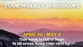 A sunrise over a mountain range creating a colorful sky. There's text that reads, 