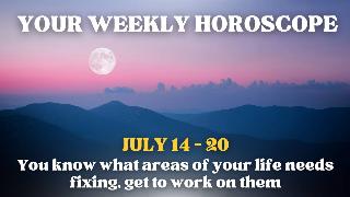 A hill range in shadow under the light of the moon in a pink and purple sky. There's text that reads, 