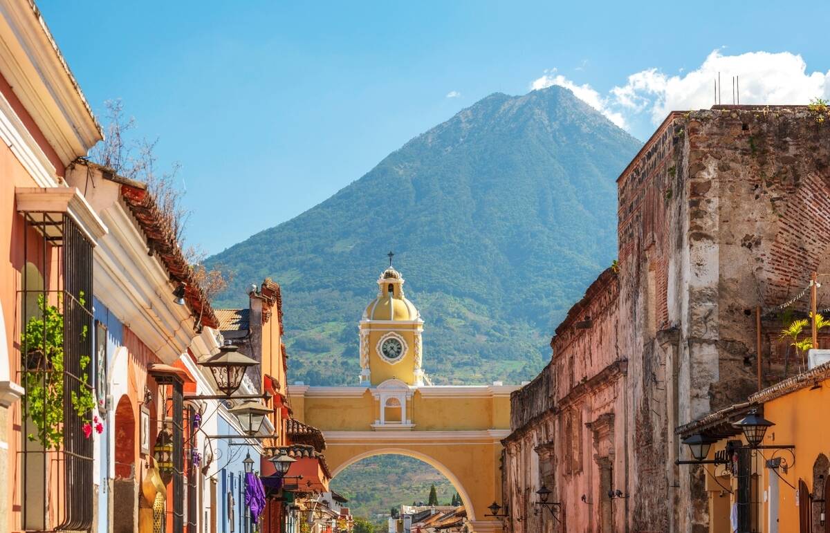 An image from Guatemala, showing a vibrant and beautiful town with a mountain in the background