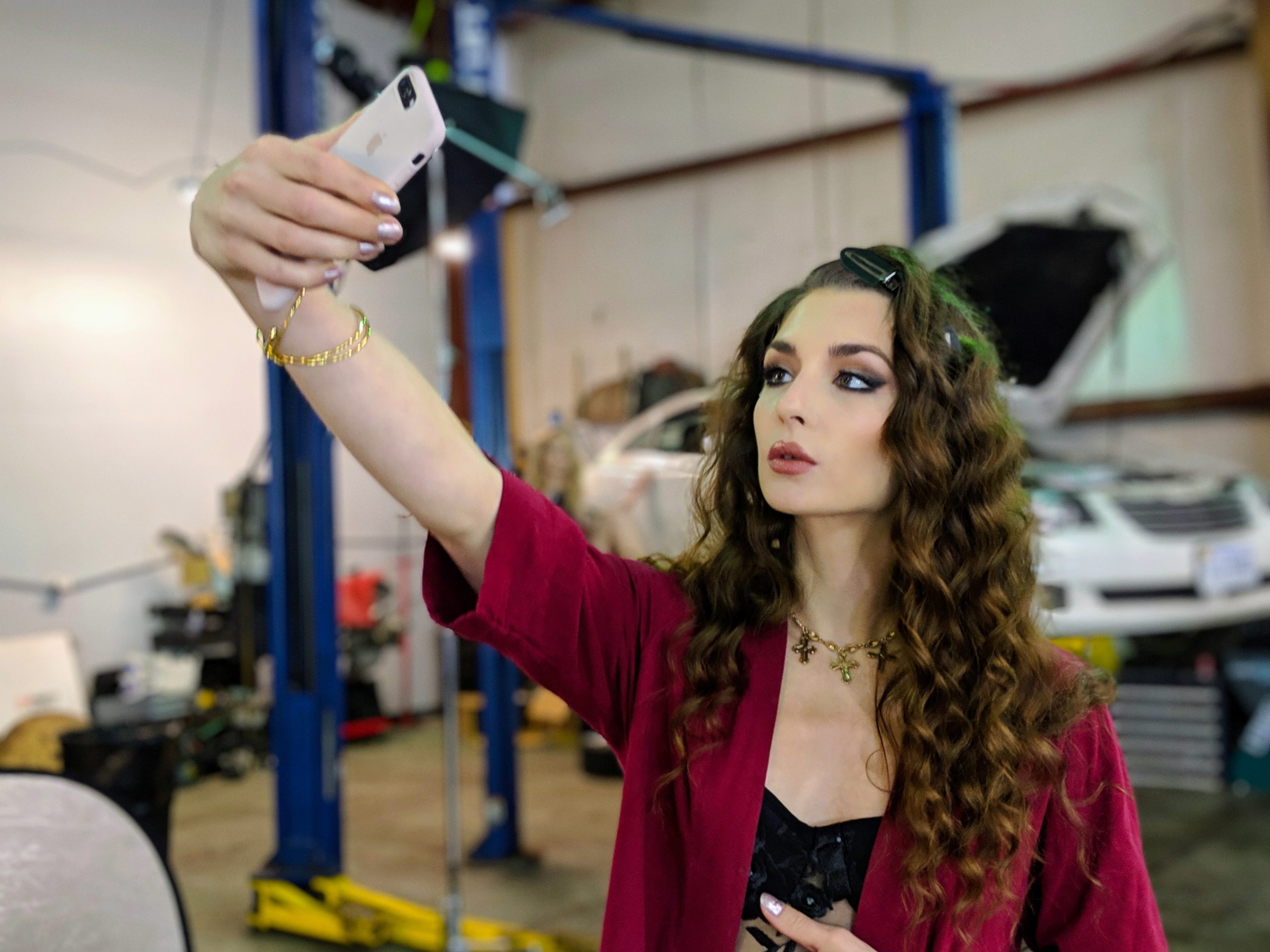 A woman taking a selfie on her phone.