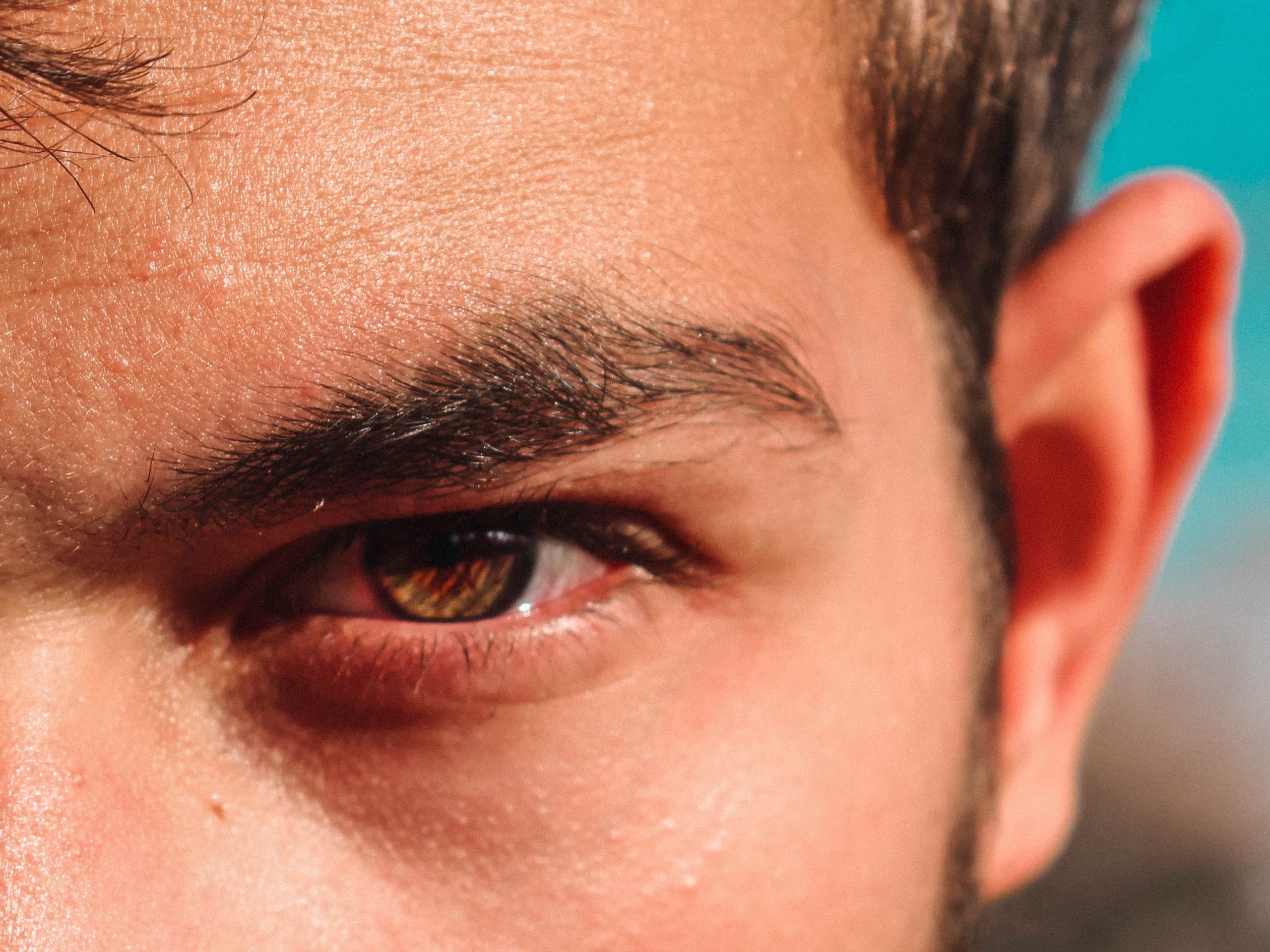 A closeup of a man's eye who's glaring.