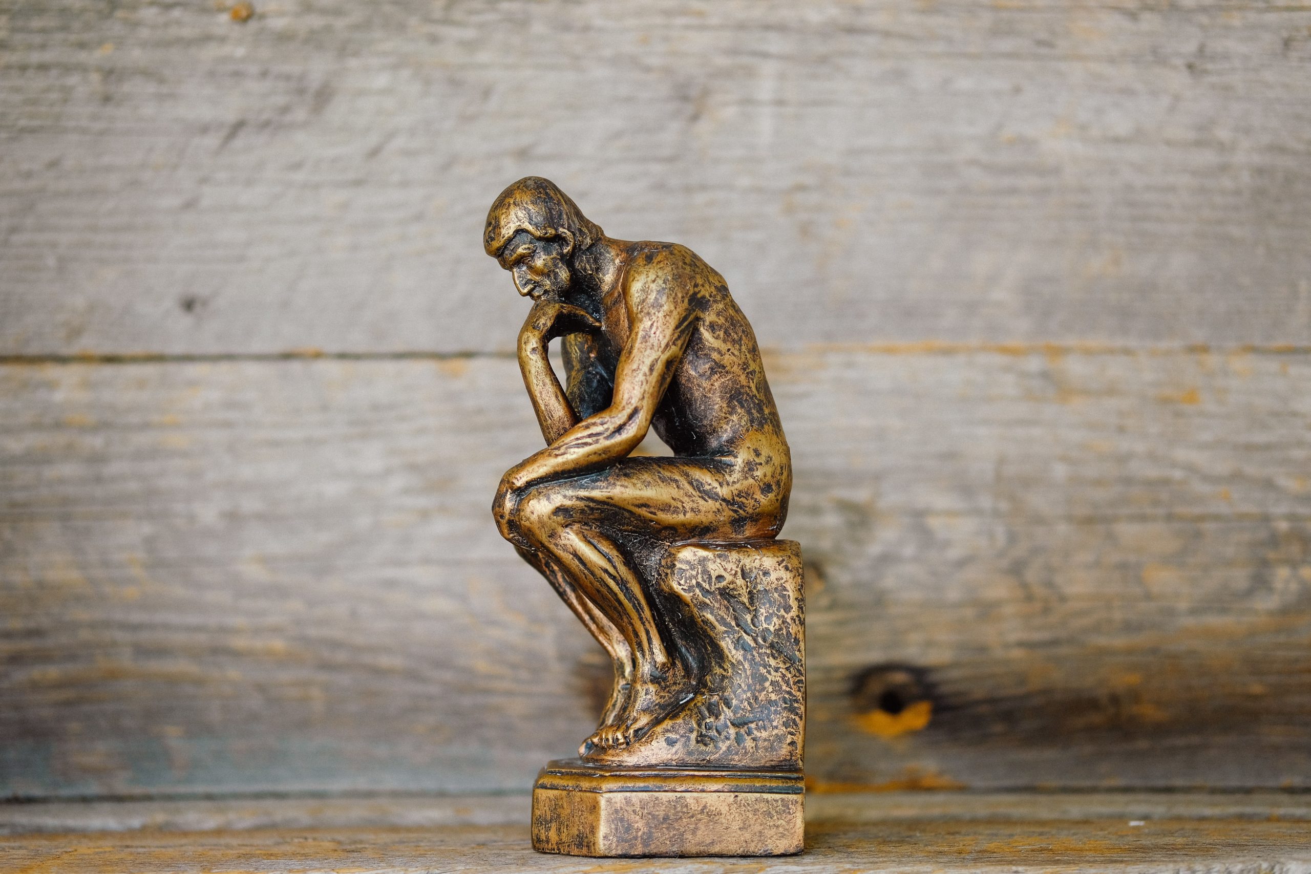 A small statue of 'The Thinker'.