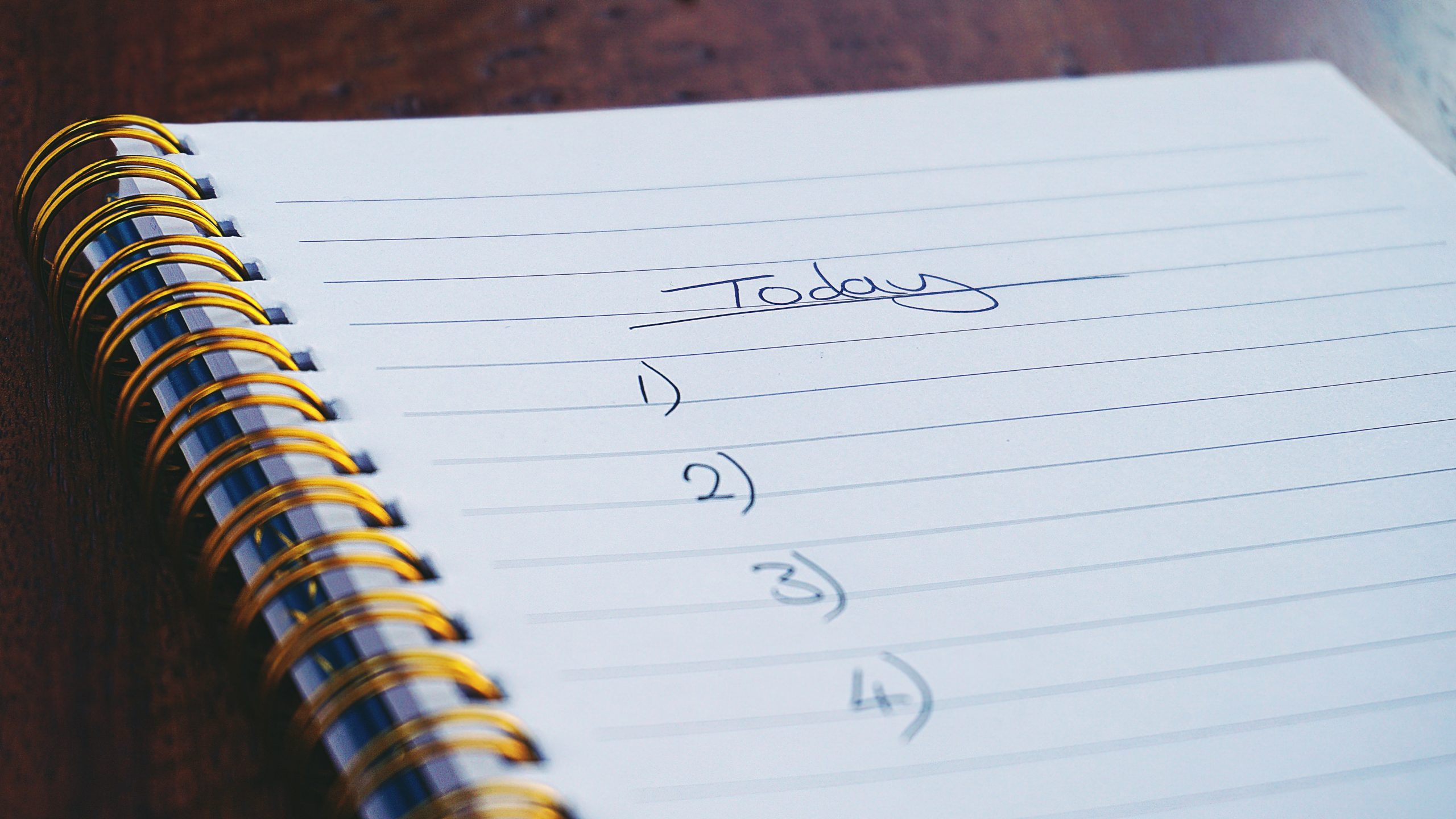 A daily checklist written on a notepad.