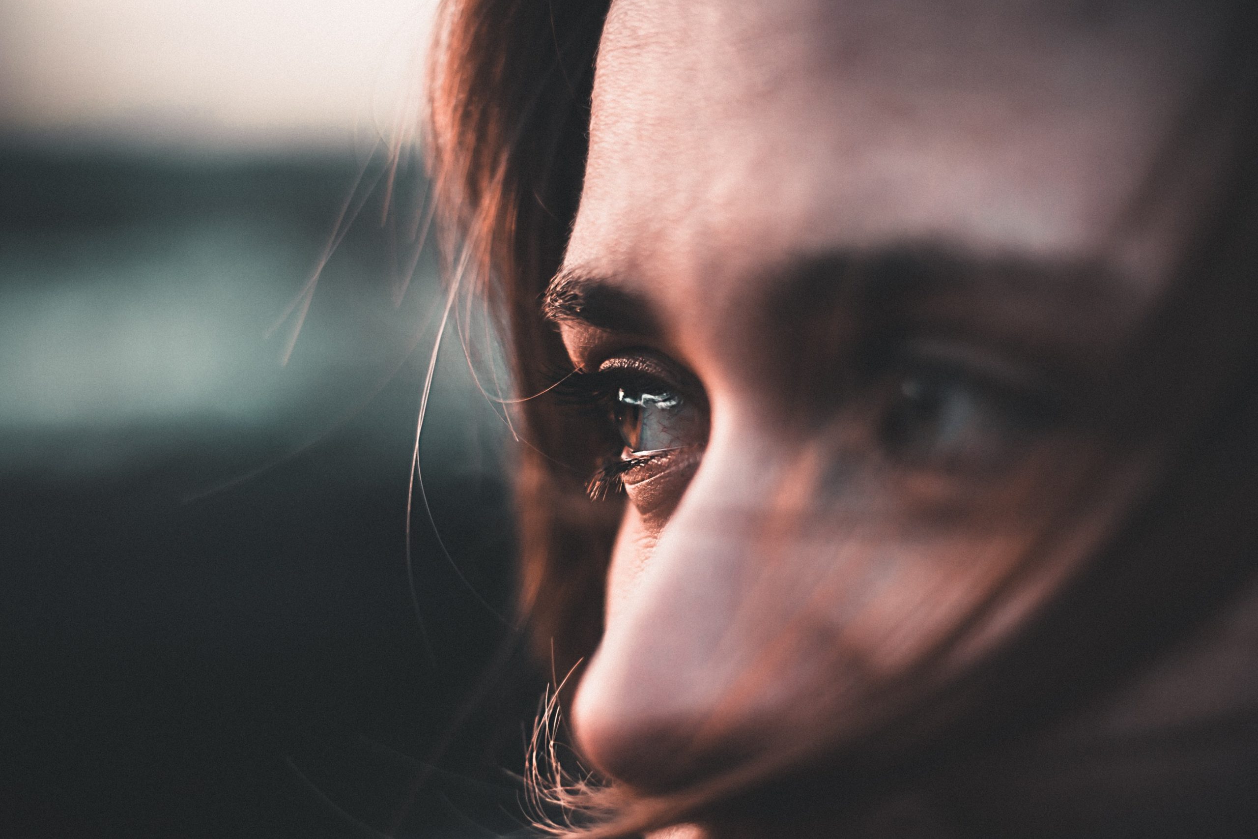 A closeup of a woman's eyes, looking off to her right.