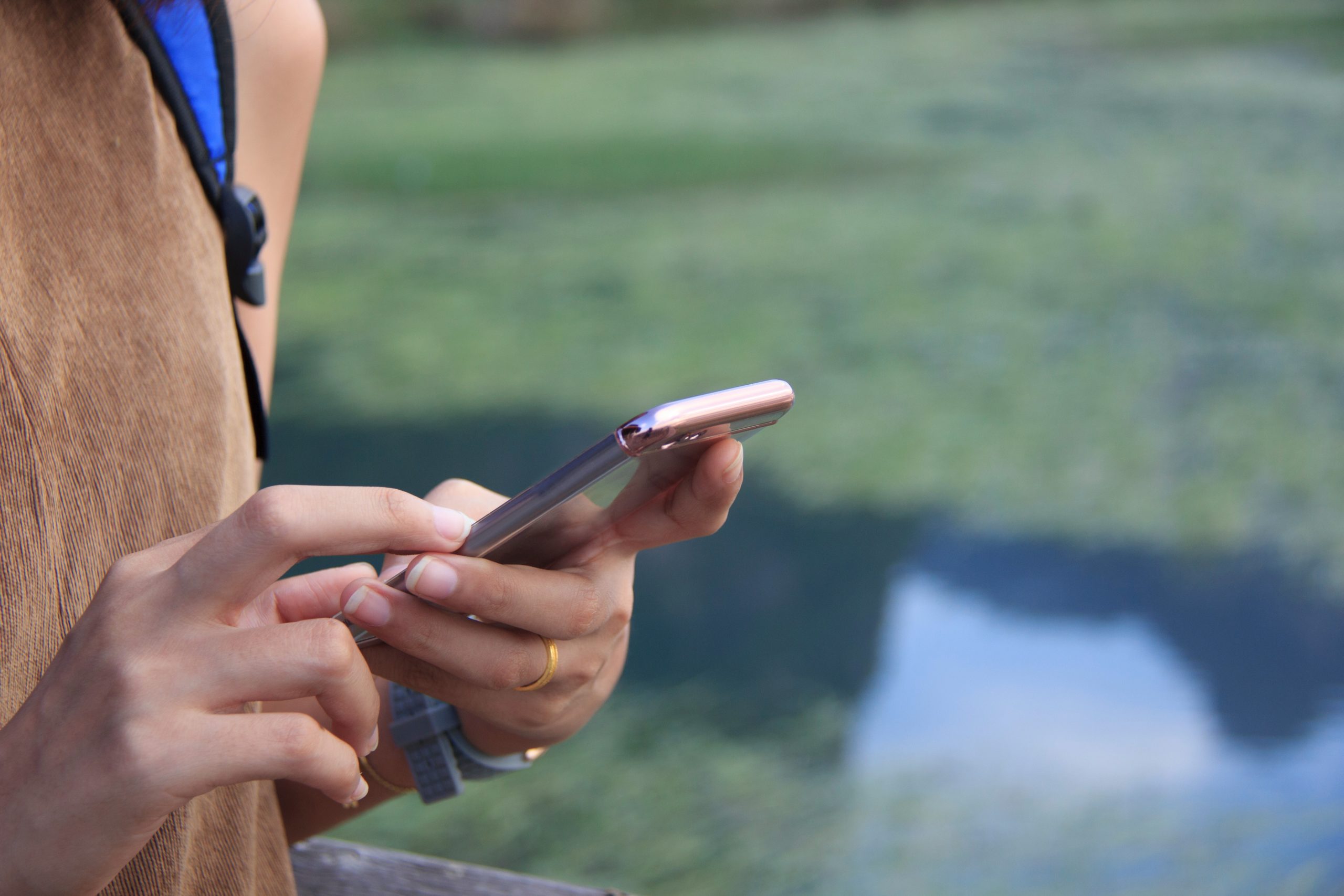 Someone holding their phone, seemingly texting.