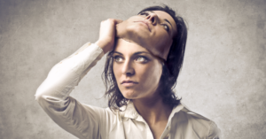 woman takes off mask of herself