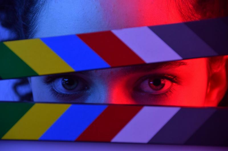 woman's eyes behind film box