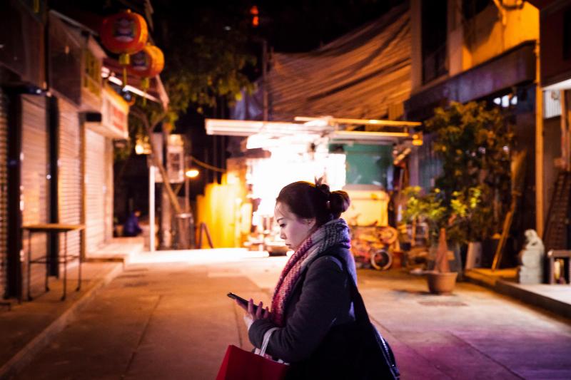 woman texting at night