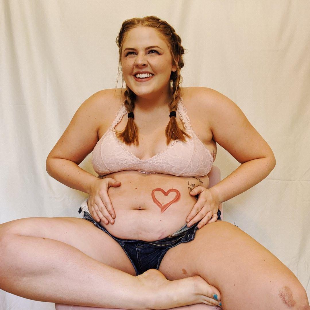 Cassidy shows off her body with drawn heart on her stomac