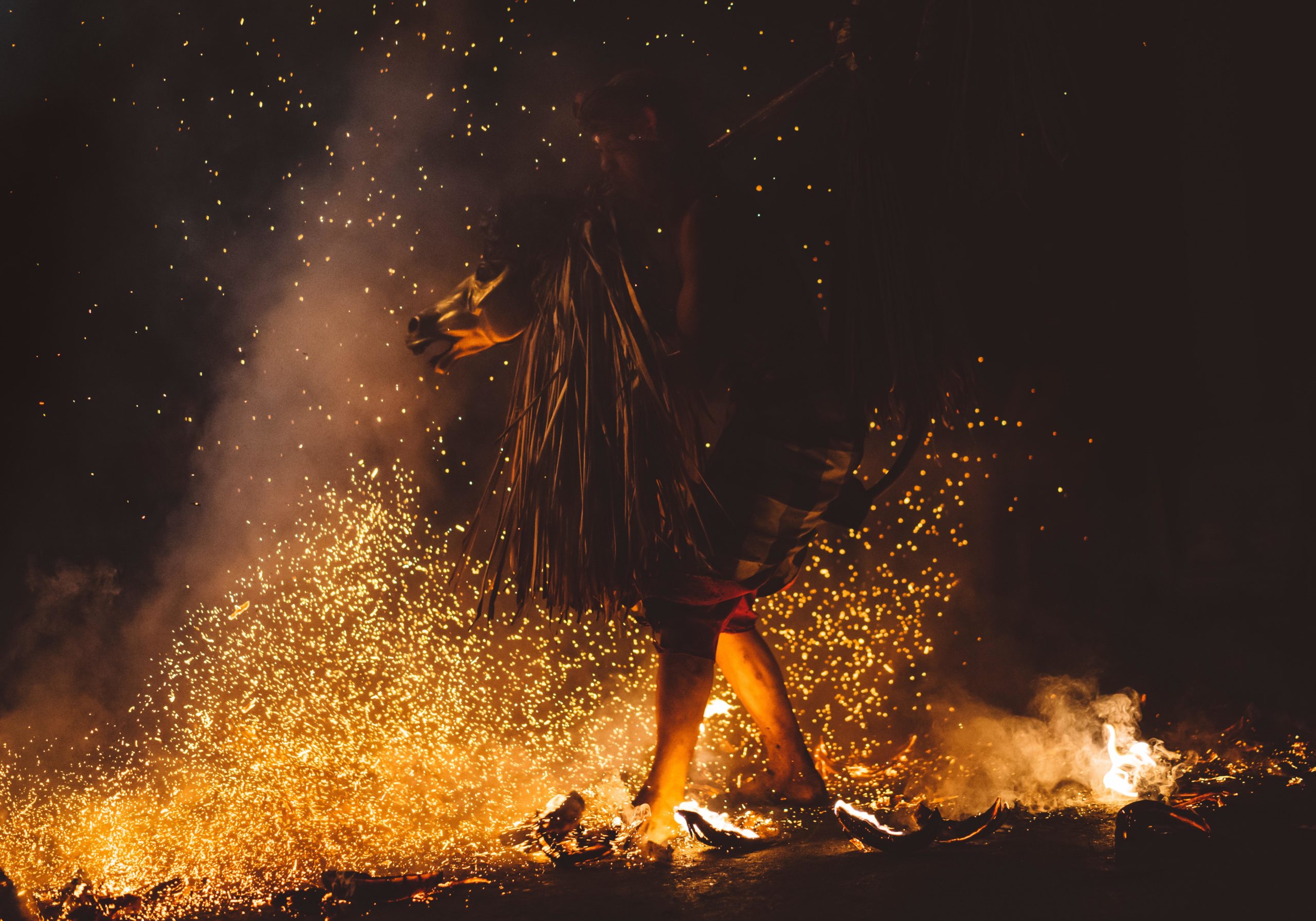 feet waling through fire sparks